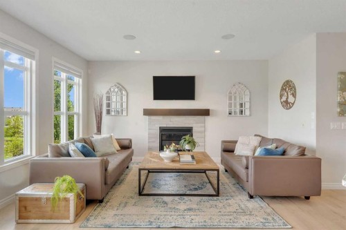 347 Hillcrest Heights Sw, Airdrie, AB - Indoor Photo Showing Living Room With Fireplace