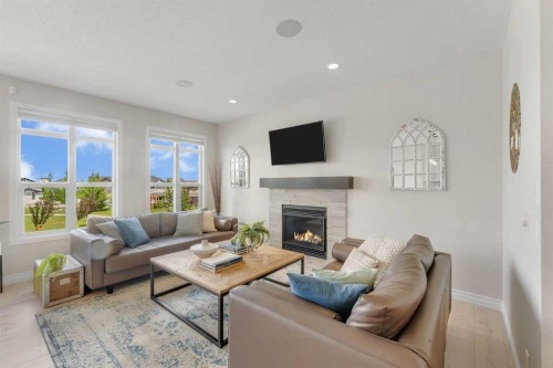 347 Hillcrest Heights Sw, Airdrie, AB - Indoor Photo Showing Living Room With Fireplace