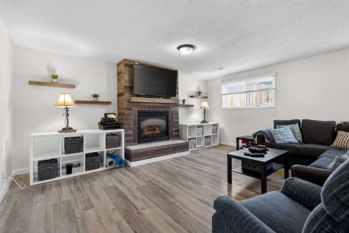 345 9 Street Se, Three Hills, AB - Indoor Photo Showing Living Room With Fireplace