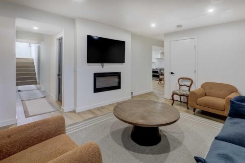 3419 Morley Trail Nw, Calgary, AB - Indoor Photo Showing Living Room With Fireplace