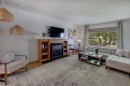 3419 Morley Trail Nw, Calgary, AB  - Indoor Photo Showing Living Room With Fireplace 