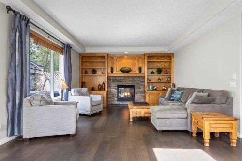 25 Panamount Green Nw, Calgary, AB - Indoor Photo Showing Living Room With Fireplace