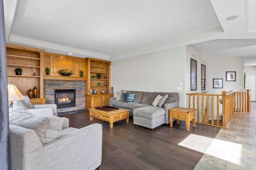 25 Panamount Green Nw, Calgary, AB - Indoor Photo Showing Living Room With Fireplace