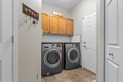 25 Panamount Green Nw, Calgary, AB - Indoor Photo Showing Laundry Room