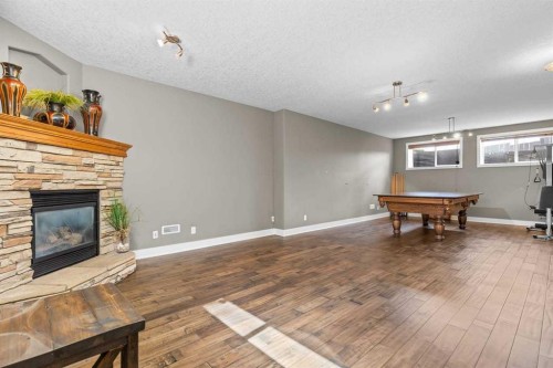 25 Panamount Green Nw, Calgary, AB - Indoor With Fireplace