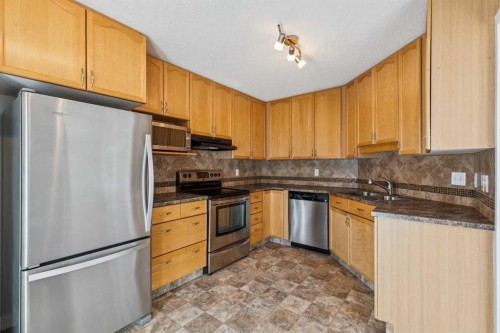 1213-1213 Sienna Park Green Sw, Calgary, AB - Indoor Photo Showing Kitchen With Stainless Steel Kitchen With Double Sink