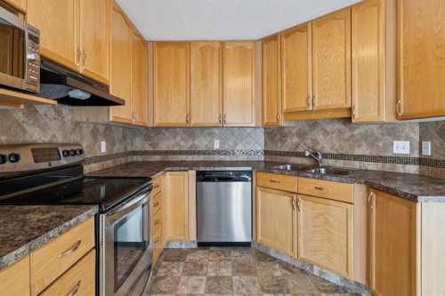 1213-1213 Sienna Park Green Sw, Calgary, AB - Indoor Photo Showing Kitchen With Stainless Steel Kitchen With Double Sink