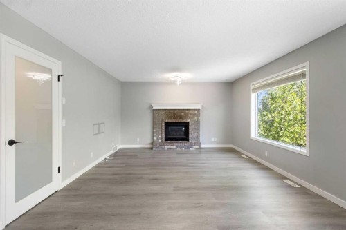 40 Mt Assiniboine Circle Se, Calgary, AB - Indoor Photo Showing Living Room With Fireplace