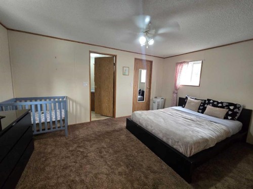 5A-6101 20 Avenue, Coleman, AB - Indoor Photo Showing Bedroom