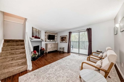 144-7172 Coach Hill Road Sw, Calgary, AB - Indoor With Fireplace