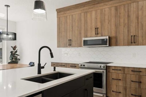 20 Wolf Creek Street Se, Calgary, AB - Indoor Photo Showing Kitchen With Double Sink With Upgraded Kitchen