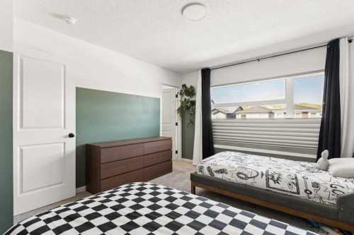 20 Wolf Creek Street Se, Calgary, AB - Indoor Photo Showing Bedroom