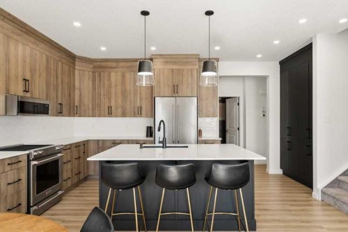 20 Wolf Creek Street Se, Calgary, AB - Indoor Photo Showing Kitchen With Upgraded Kitchen
