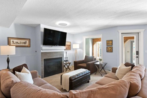 366 Patterson Boulevard Sw, Calgary, AB - Indoor Photo Showing Living Room With Fireplace