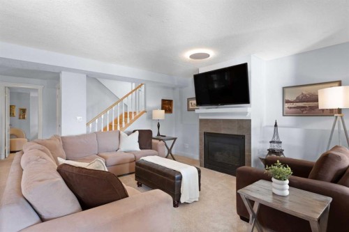 366 Patterson Boulevard Sw, Calgary, AB - Indoor Photo Showing Living Room With Fireplace