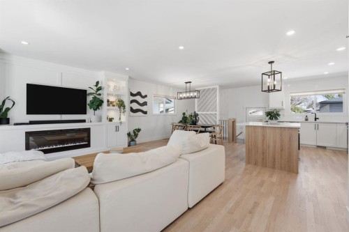 87 Armstrong Crescent Se, Calgary, AB - Indoor Photo Showing Living Room With Fireplace