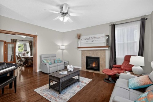 90 Sage Hill Way Nw, Calgary, AB - Indoor Photo Showing Living Room With Fireplace