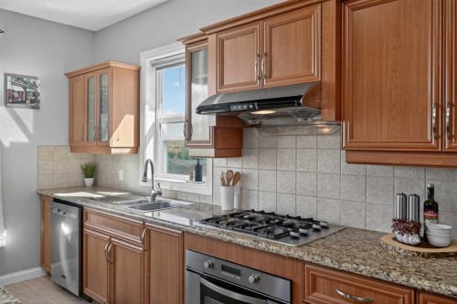 90 Sage Hill Way Nw, Calgary, AB - Indoor Photo Showing Kitchen With Double Sink With Upgraded Kitchen