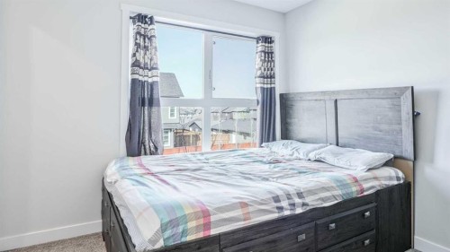 100 Carringvue Way Nw, Calgary, AB - Indoor Photo Showing Bedroom