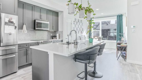 100 Carringvue Way Nw, Calgary, AB - Indoor Photo Showing Kitchen With Stainless Steel Kitchen With Upgraded Kitchen