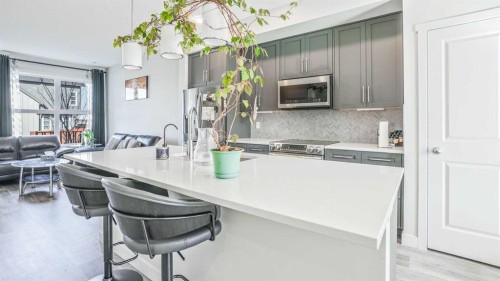 100 Carringvue Way Nw, Calgary, AB - Indoor Photo Showing Kitchen With Upgraded Kitchen