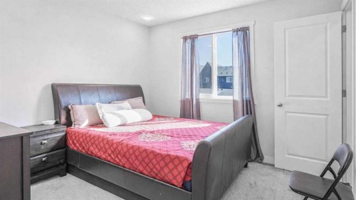 100 Carringvue Way Nw, Calgary, AB - Indoor Photo Showing Bedroom