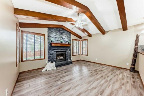 40 Tuscany Vista Crescent Nw, Calgary, AB - Indoor Photo Showing Living Room With Fireplace