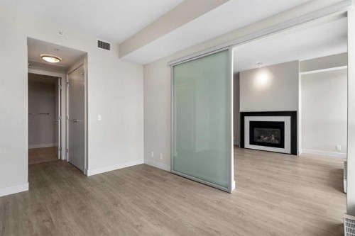 1712-222 Riverfront Avenue Sw, Calgary, AB - Indoor With Fireplace