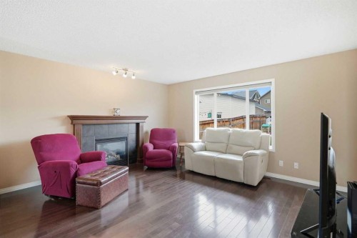 383 Fireside Place, Cochrane, AB - Indoor Photo Showing Living Room With Fireplace