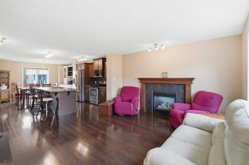 383 Fireside Place, Cochrane, AB - Indoor Photo Showing Living Room With Fireplace