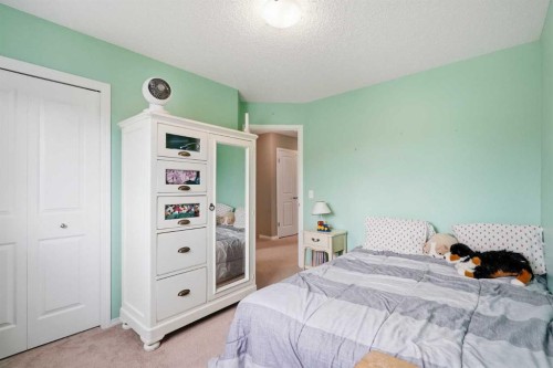 383 Fireside Place, Cochrane, AB - Indoor Photo Showing Bedroom
