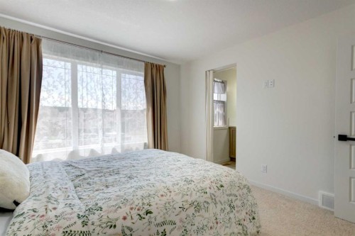 30 Creekside Manor Sw, Calgary, AB - Indoor Photo Showing Bedroom