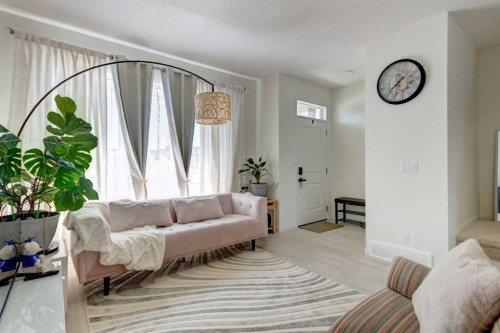 30 Creekside Manor Sw, Calgary, AB - Indoor Photo Showing Living Room
