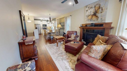 4-7001 52 Street, Lacombe, AB - Indoor Photo Showing Living Room With Fireplace
