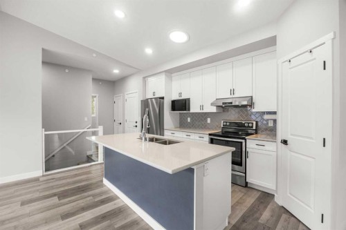 289 Lucas Avenue Nw, Calgary, AB - Indoor Photo Showing Kitchen With Stainless Steel Kitchen With Double Sink With Upgraded Kitchen