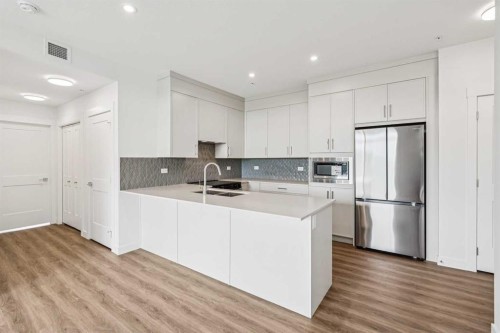 3303-3700 Seton Avenue Se, Calgary, AB - Indoor Photo Showing Kitchen With Double Sink With Upgraded Kitchen