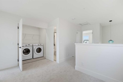 2437 Creeker Lane, Airdrie, AB - Indoor Photo Showing Laundry Room