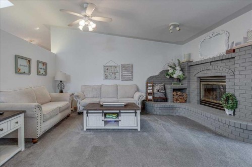 29104 Highway 27, Rural Mountain View County, AB - Indoor Photo Showing Living Room With Fireplace