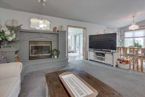 29104 Highway 27, Rural Mountain View County, AB - Indoor Photo Showing Living Room With Fireplace