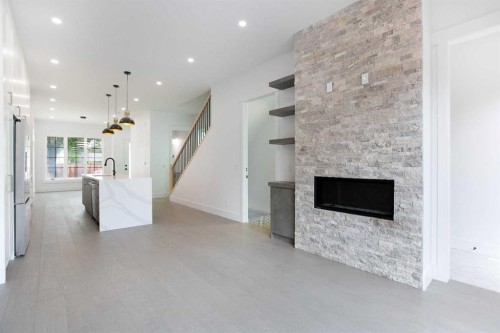 1108 6 Street Ne, Calgary, AB - Indoor Photo Showing Living Room With Fireplace