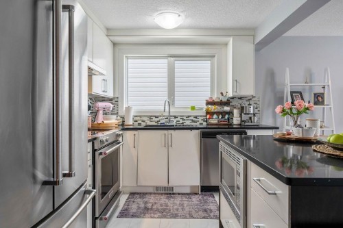 15 Woodmont Green Sw, Calgary, AB 