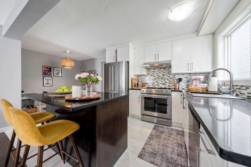 15 Woodmont Green Sw, Calgary, AB 