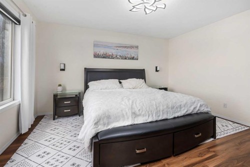 704 Woodside Drive Nw, Airdrie, AB - Indoor Photo Showing Bedroom