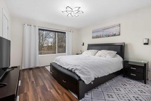 704 Woodside Drive Nw, Airdrie, AB - Indoor Photo Showing Bedroom
