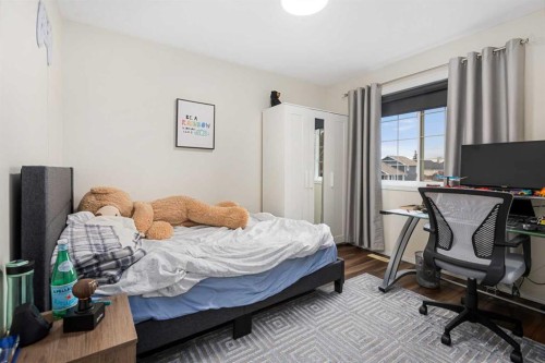 704 Woodside Drive Nw, Airdrie, AB - Indoor Photo Showing Bedroom