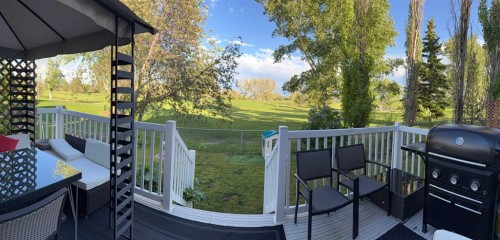 704 Woodside Drive Nw, Airdrie, AB - Outdoor With Deck Patio Veranda With Exterior