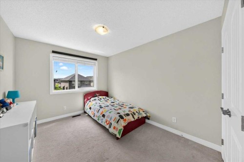 62 Evanscrest Road Nw, Calgary, AB - Indoor Photo Showing Bedroom