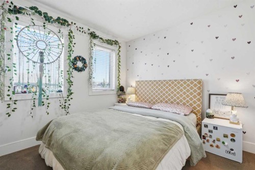 245 Cimarron Vista Way, Okotoks, AB - Indoor Photo Showing Bedroom
