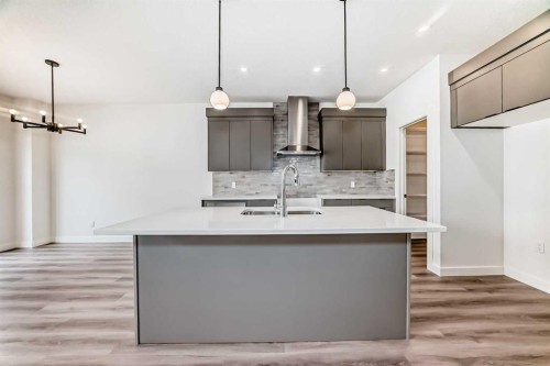 109 Heritage Park, Cochrane, AB - Indoor Photo Showing Kitchen With Double Sink With Upgraded Kitchen