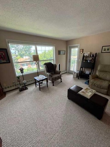 302-105 7 Avenue Se, High River, AB 